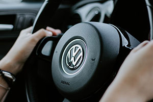 Hands on steering wheel of luxurious car